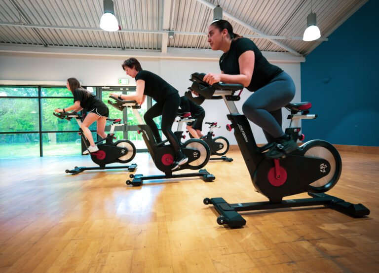 Members riding in a spin class at Hanworth